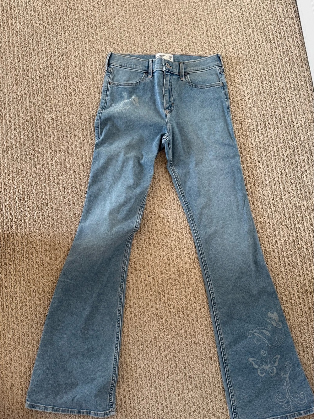 abercrombie kids light blue flared jeans with butterfly details